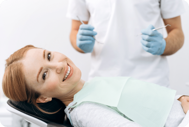 Woman sitting in dental chair smiling